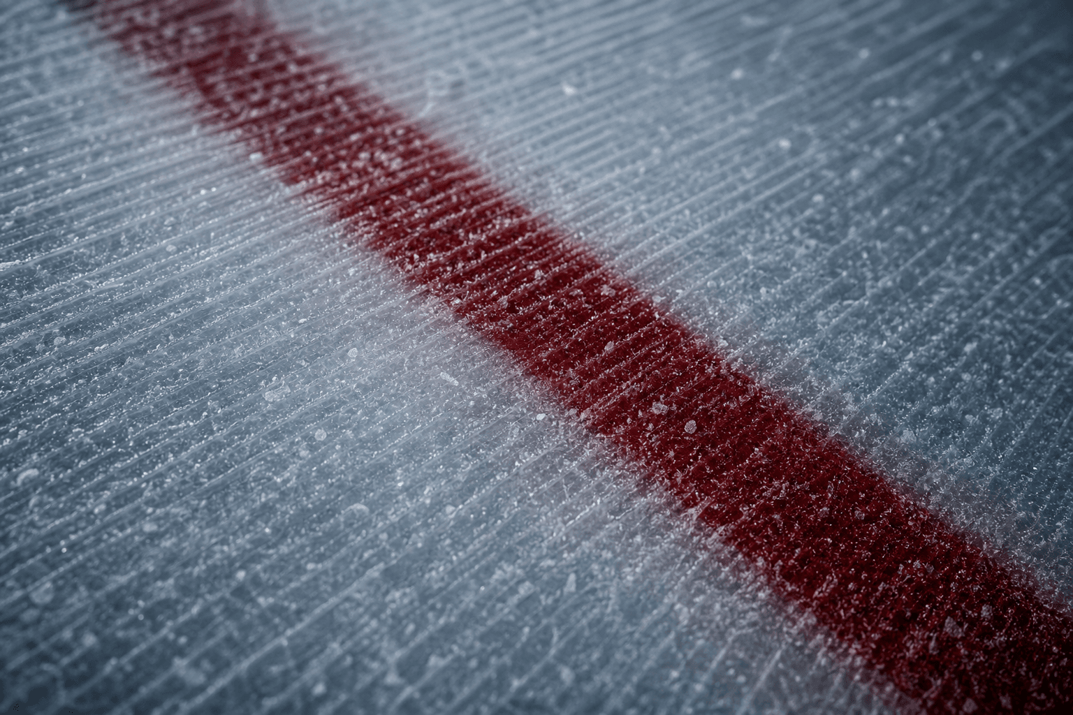 Macro photograph of freshly cut ice and a painted red line